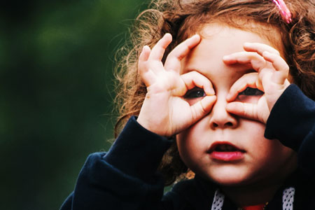 Girl Making Hand Binoculars