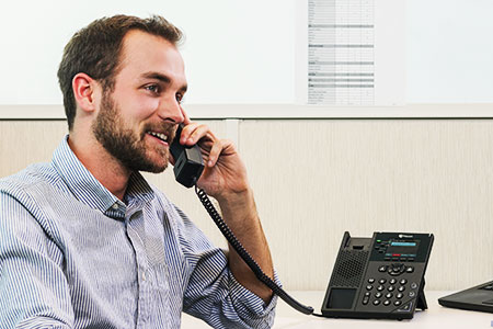 Man Using Polycom VVX 250